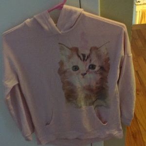 A light pink, kitten sweatshirt.